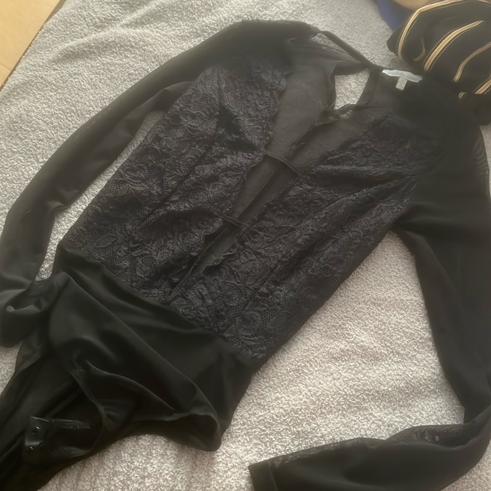 Lacy black body suit with deep V open front